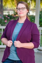 Pictured: Professor Rebecca Harrison - A woman with glasses posing for photo