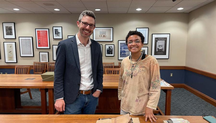 John Murphy, the Loeb’s curator of prints and drawings, and Ford Scholar Carissa Kolcun pose with 11033, an artist’s book that chronicles the story of Mary Morst, who gave birth to twins while she was incarcerated in a Virginia prison in 1913.