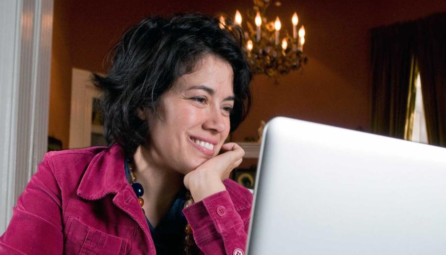Caterina Fake sitting in front of a laptop