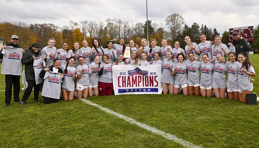 A group photo of the champions taken on the field.