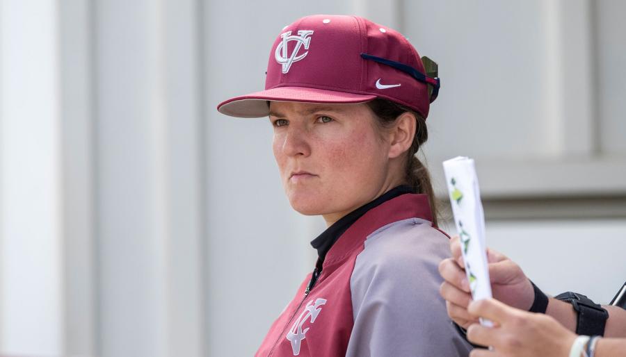 Person wearing a baseball cap staring off screen intensely.