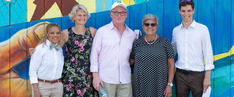 Poet Gold, President Bradley, Mayor Rolison, Professor Maria Hoehn, and Matthew Brill-Carlat celebrate the mural painted by New Americans Summer Program students at Vassar College in collaboration with Artolution.