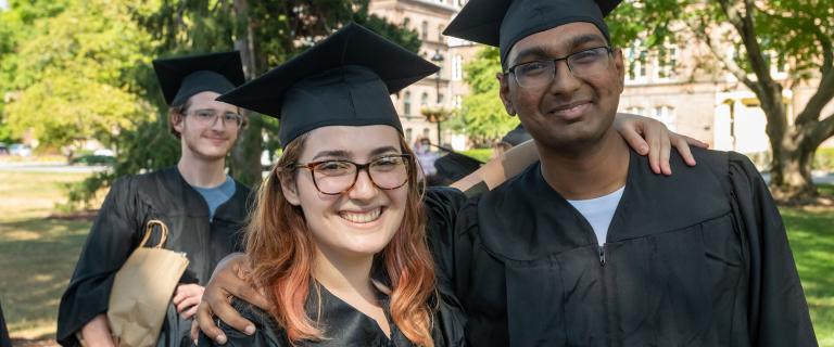 Students wearing caps and gowns posing for photo at Vassar College Convocation.