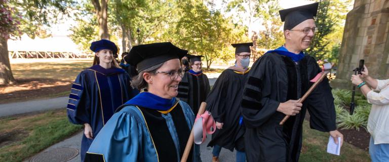 Professors in caps and gowns in procession at Vassar College Convocation.