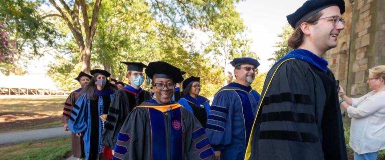 Professors in caps and gowns in procession at Vassar College Convocation.