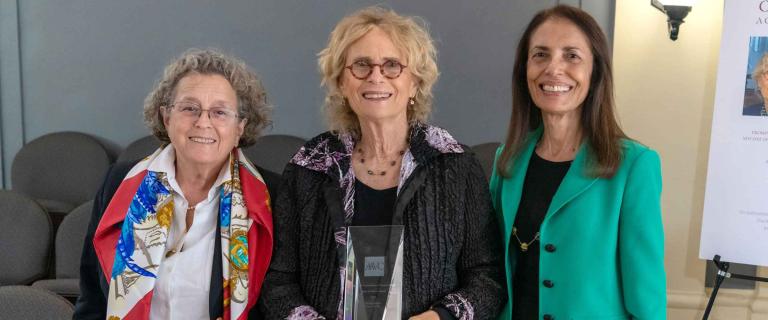 Brenda Feigen, wearing a black shirt and black and purple sweater, Amy Pullman, wearing a white shirt and multi colored scarf and Monica Vachher wearing a black shirt and green jacket.