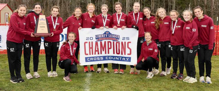 Team photo with athletes holding a banner that reads: 2025 Liberty League Champions Cross Country.