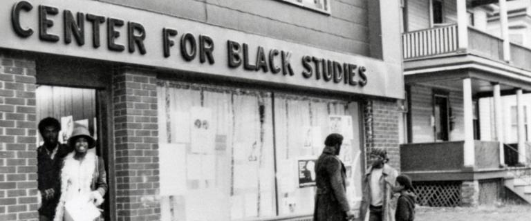 People outside of a building with a sign that reads: Center for Black Studies.