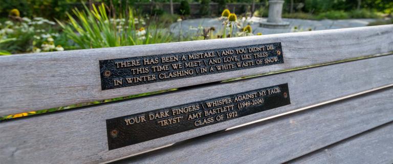 Back of bench in Shakespeare Garden with two plaques, containing a poem by Amy Bartlett, and the Class of 1972 as the sponsor of the bench.
