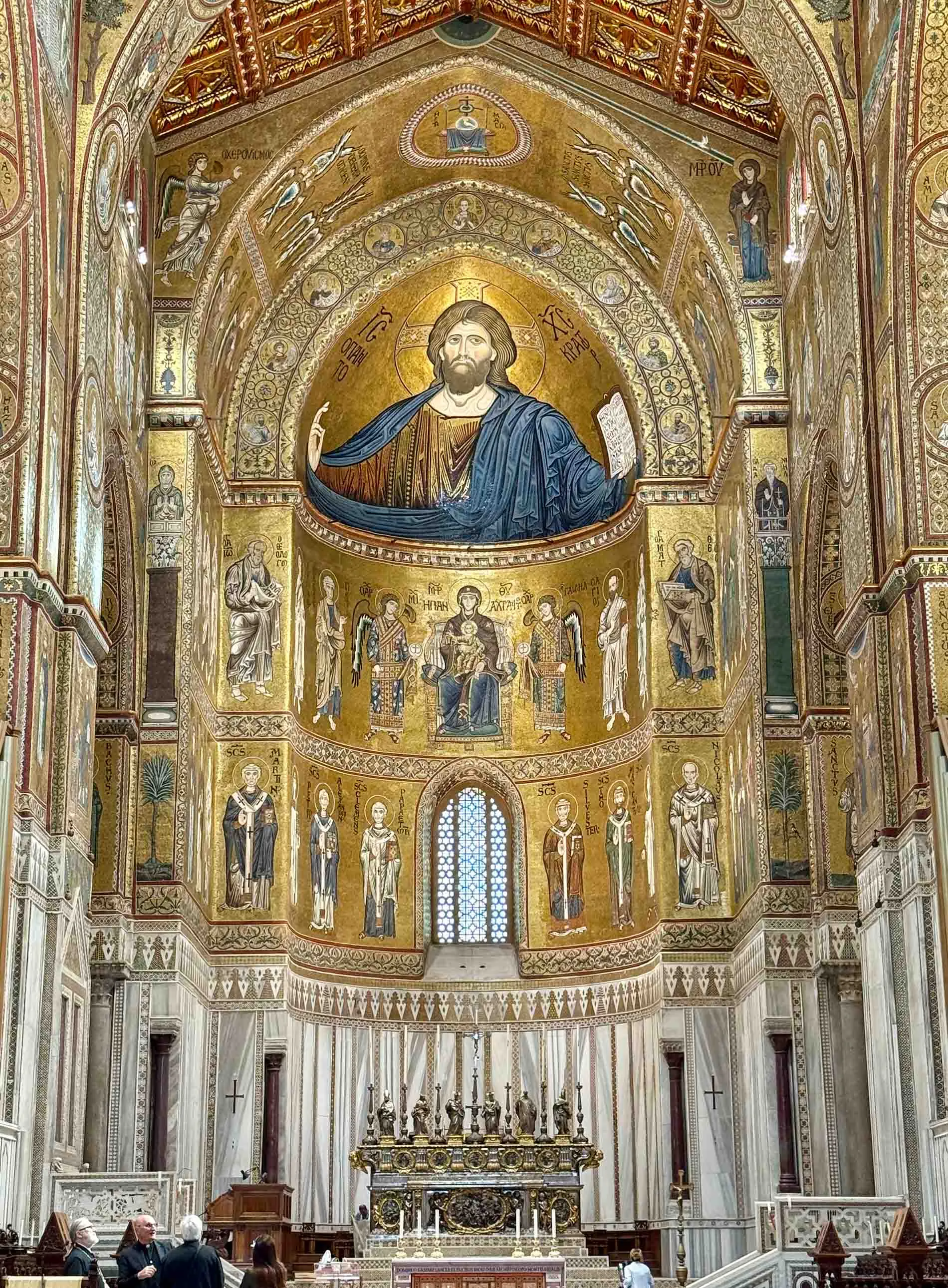 Apse of the Cathedral of Monreale, 12th c., an ornate church interior with a large gold mosaic of Christ above the altar.