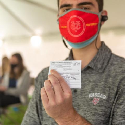 Person Showing their Vaccine Card