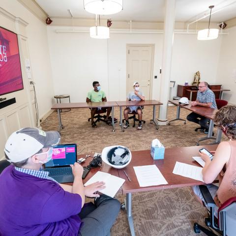 Bryan Corrigan (far right), Project Manager for Vassar’s Office of Facilities and Operations, addressed Exploring College students on the challenges the College faces renovating some of its older buildings to make them energy-efficient.