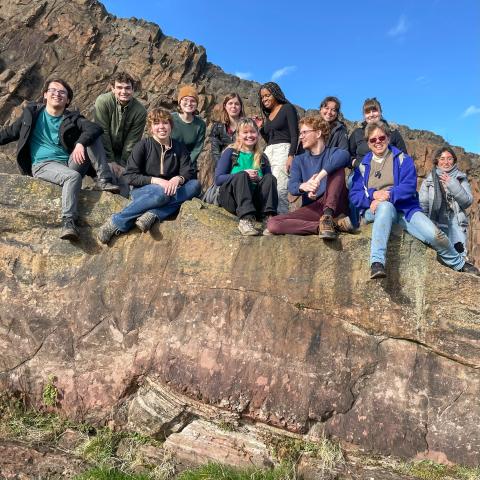 Students standing on the birthplace of modern Geology, Siccar Point.