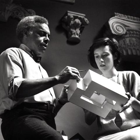 Architect  Jeh Vincent Johnson and a student holding a model