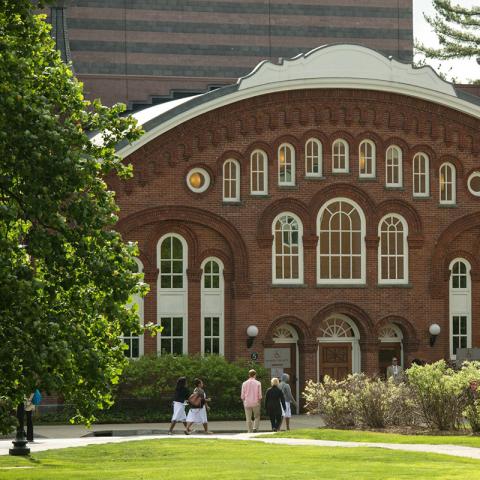 Front of the Vogelstein Center for Drama and Film Building with people walking in front.