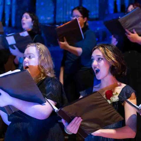 women singing in a chorus