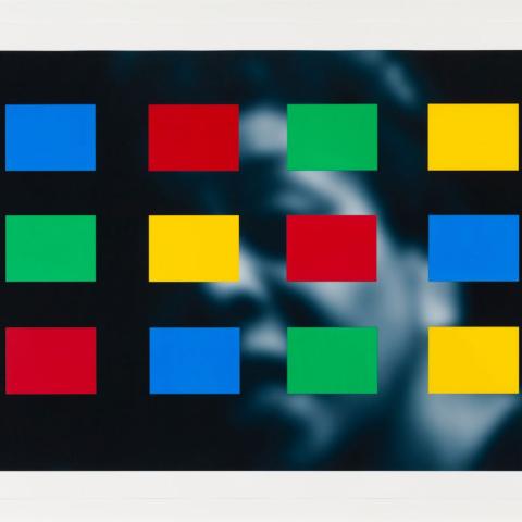 Art work with a black and white photo of a face in the background and a grid of yellow, blue, green, and red rectangles partially obscuring the photo in the foreground