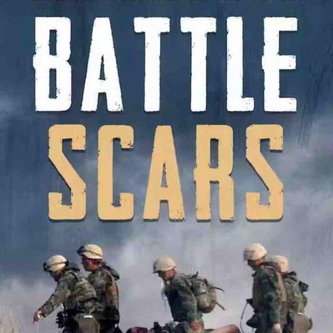 The cover of a book. The title of the book is "Battle Scars". The author is Chip Reid. The cover shows a photograph of several soldiers carrying an injured soldier in a stretcher.