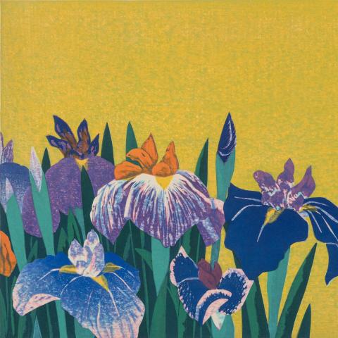 Colorful print of blue and purple iries against a yellow background.