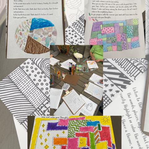 A photo of several pages with text and drawings on them.
