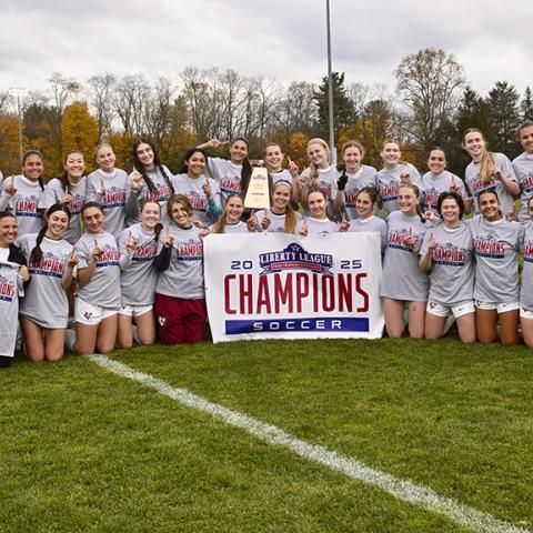 A group photo of the champions taken on the field.