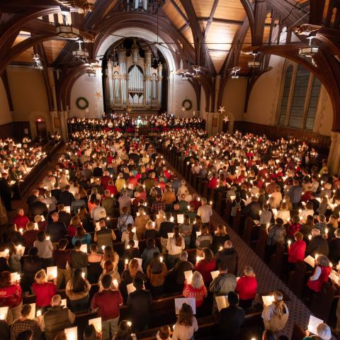 Birds eye view of a candle service in a house of worship.