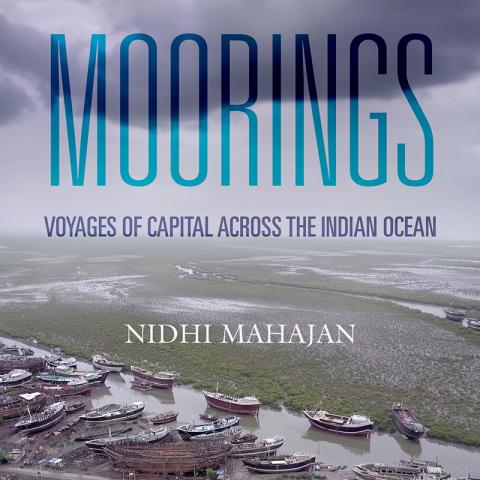Book cover with photo of marshland under a stormy sky and fishing boats strewn along the shore.