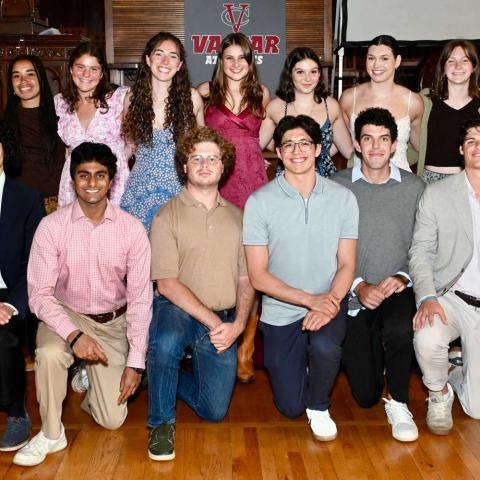 Two rows of people smiling for a photo.