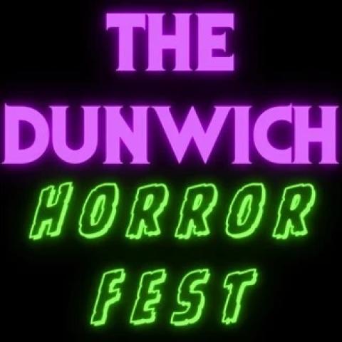 Poster reading “The Dunwich Horror Fest” in glowing neon-style lettering on a black background. “The Dunwich” appears in bright purple, while “Horror Fest” appears in vivid green, creating a retro horror and sci-fi aesthetic.