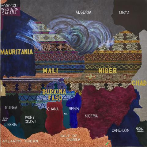 Photo of a quilt that is also a map with countries and borders.