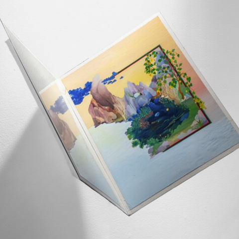 Two angled painted panels depicting a colorful landscape with rocky peaks, blue water, and trailing green foliage beneath a yellow sky.