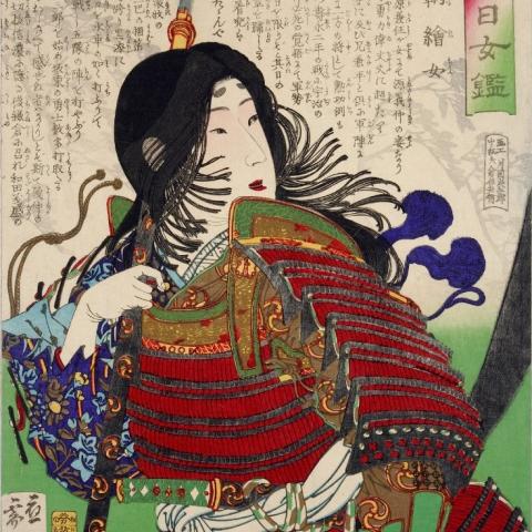 Woodblock print: Tomoe Gozen in bright red samurai armor holding a tall naginata polearm against a backdrop of Japanese calligraphy.