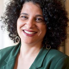 Maria Hantzopoulos wearing a green jacket against a light background.