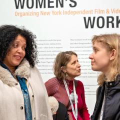 Attendees engage in conversation at the opening of the exhibition "Women's Work: Organizing New York Independent Film & Video" at Vassar College.