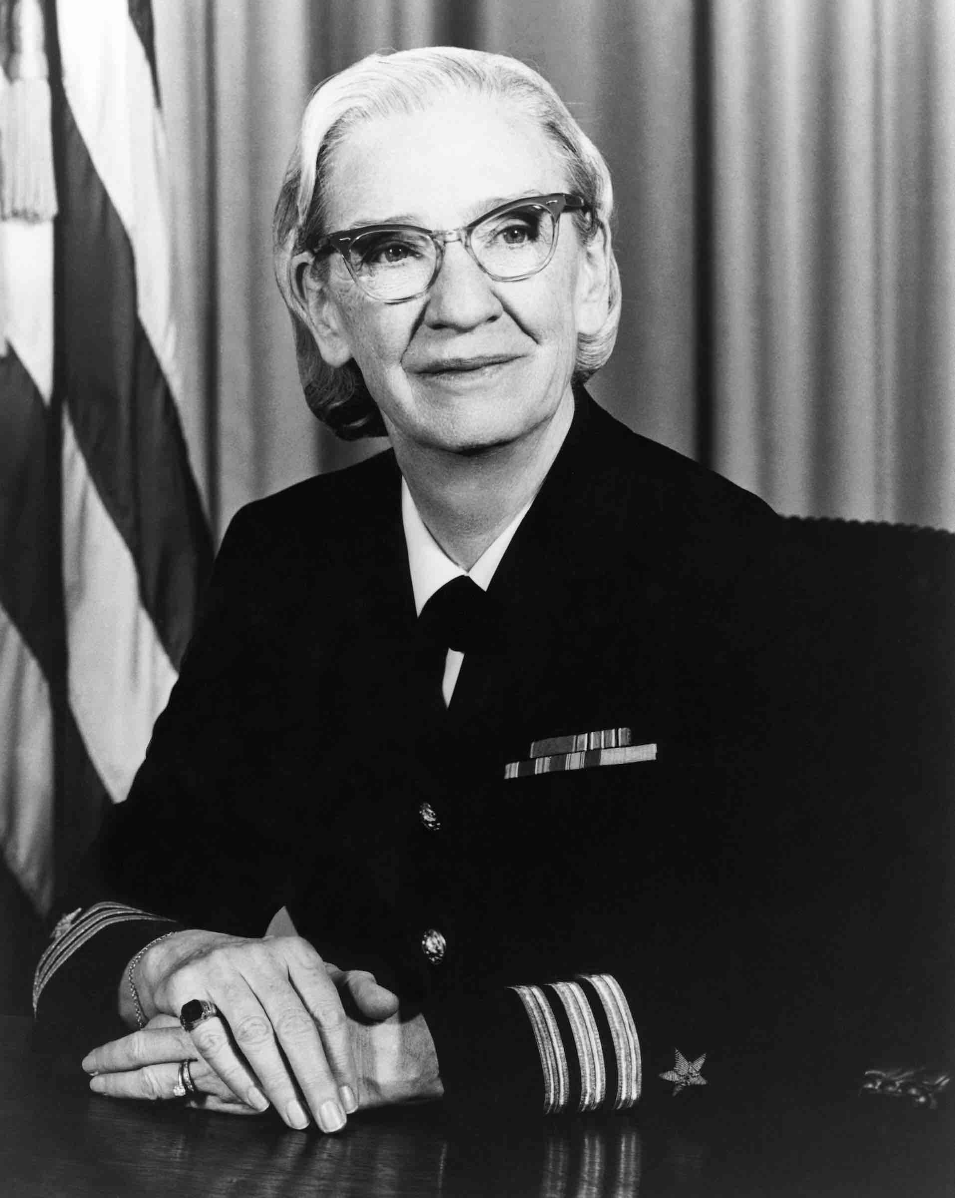 A black and white picture of Grace Hopper in her military uniform
